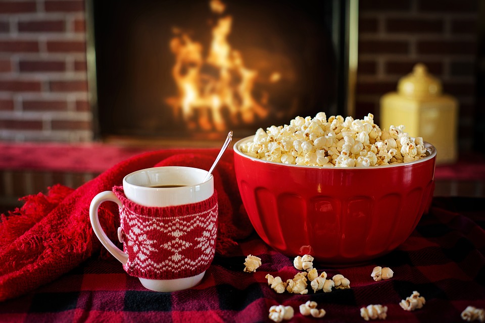 cosy hot chocolate and popcorn by the fireplace