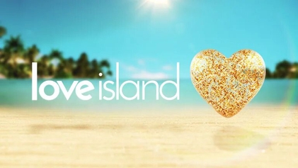 love island intro screen logo with gold sparkly heart on a beautiful sandy beach