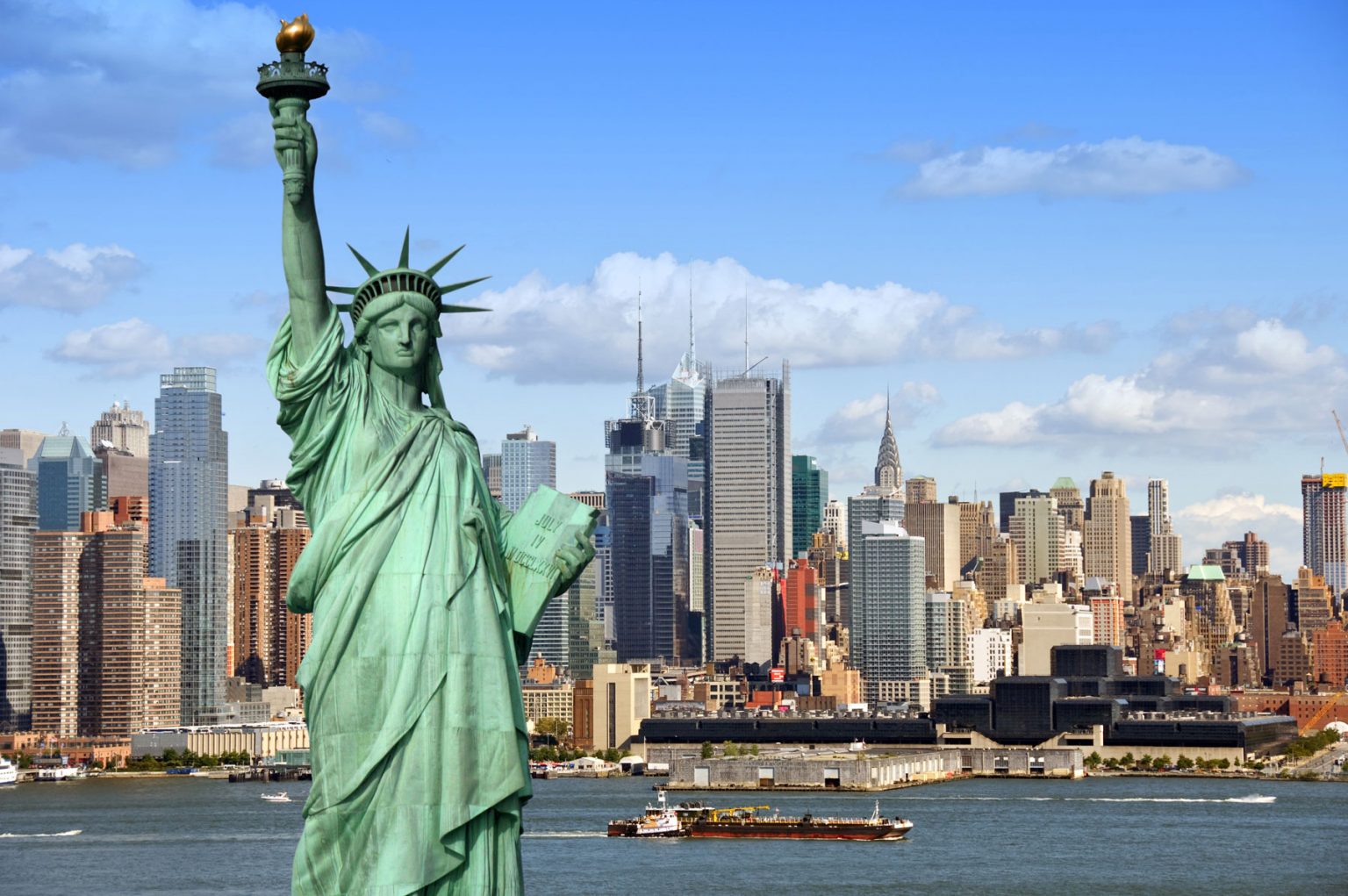 statue of liberty with the New York skyline in the background