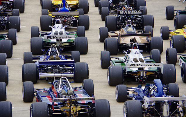 Formula 1 cars lined up on race track