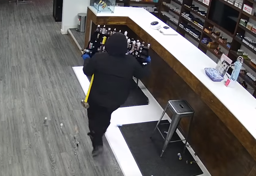 a burglar attempting to steal from a Canadian vape shop