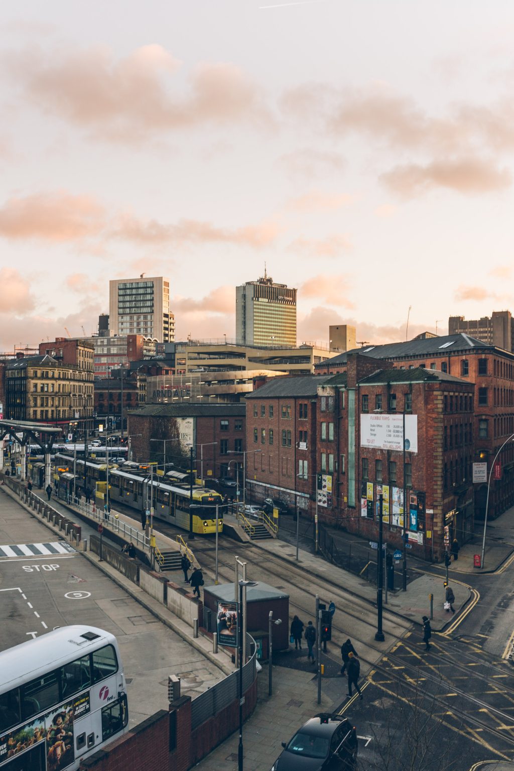 Manchester street with trams and busses