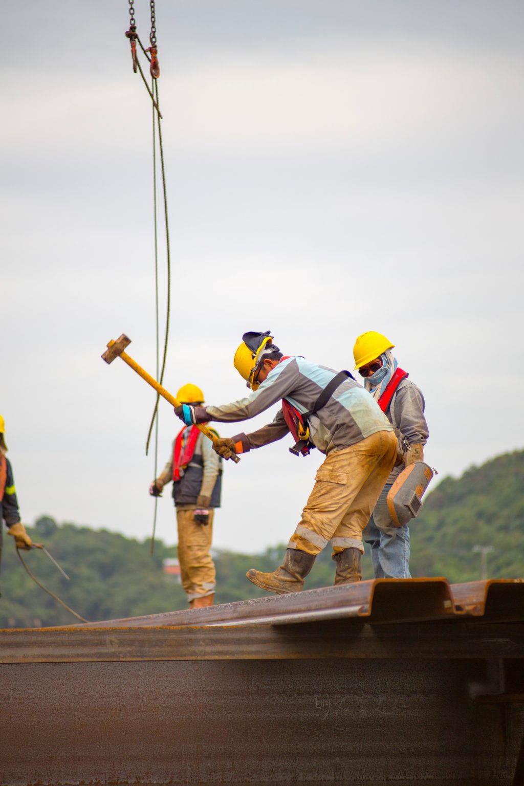 construction workers on a roof