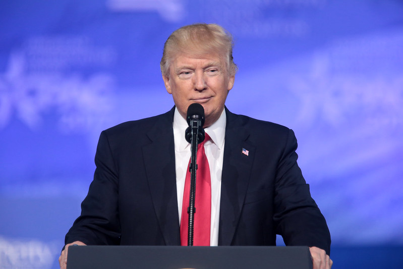 Donald Trump smiling at a press conference