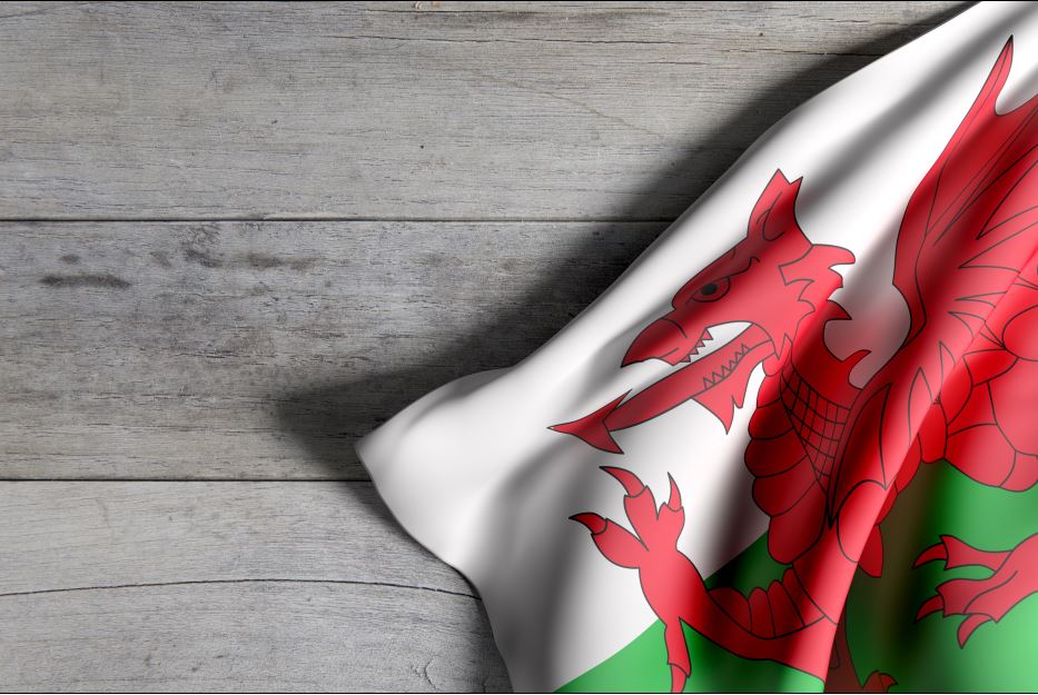 Wales flag on wood floor