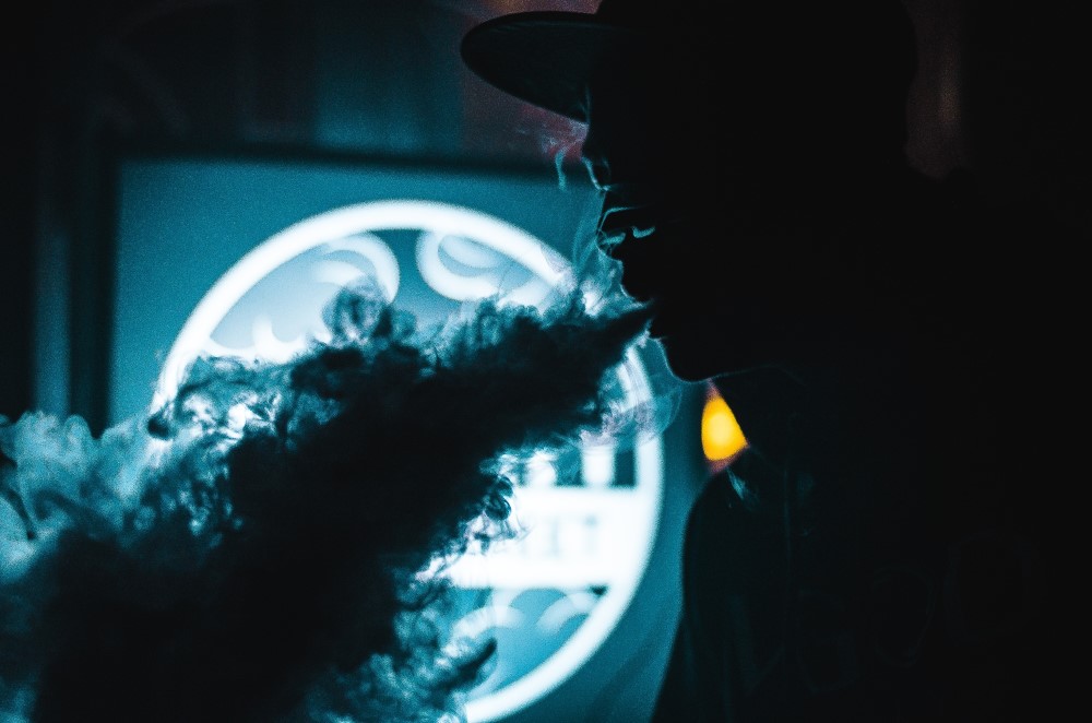 Silhouette of a man vaping