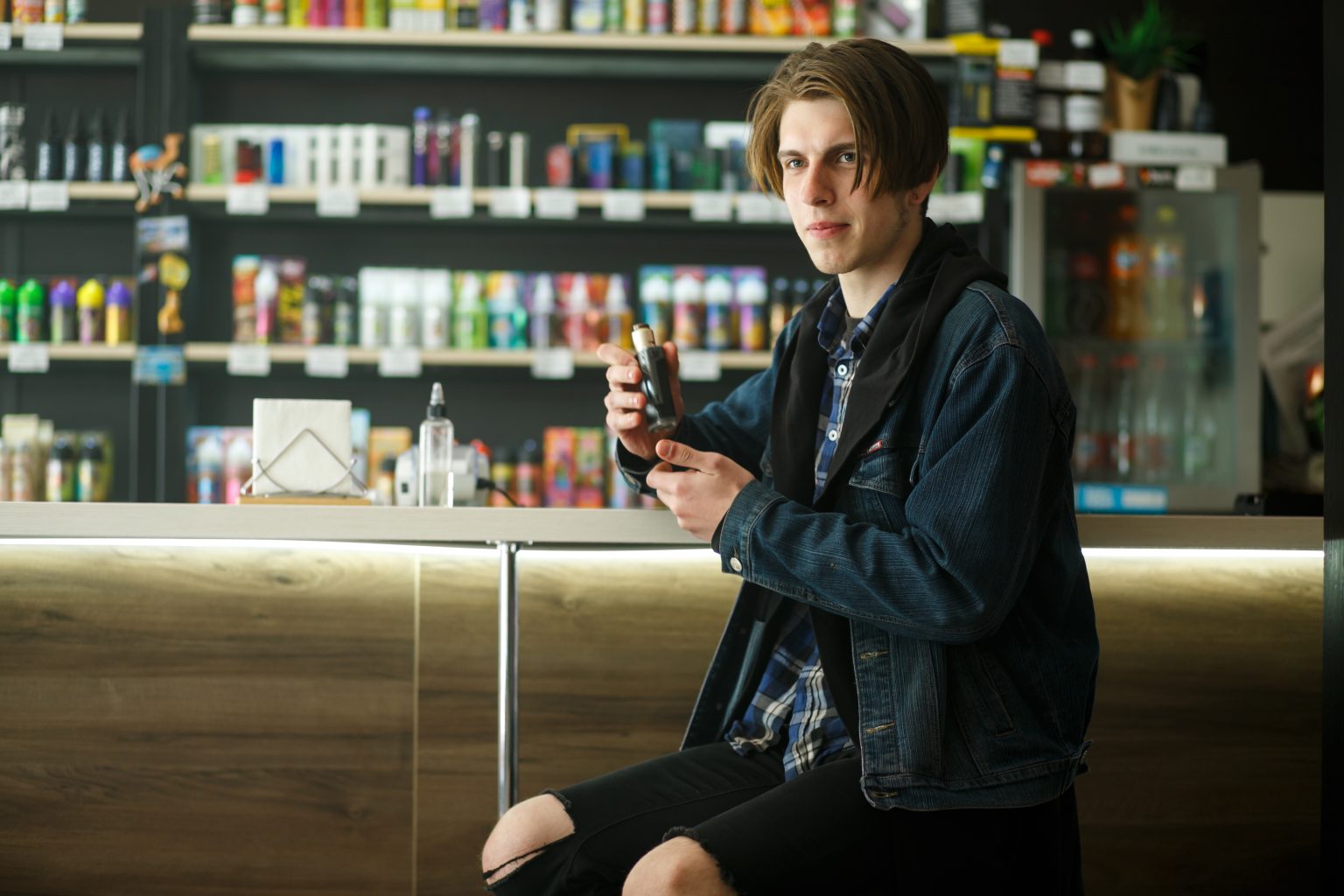 Man sitting in vape shop