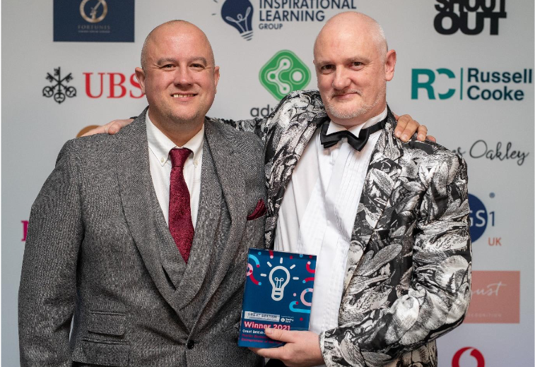 Zeus Juice founder and brother with Family Business Entrepreneur of the Year award at the Great British Entrepreneur Awards ceremony