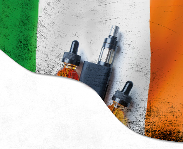 irish flag behind a black vape mod device and two eliquid bottles