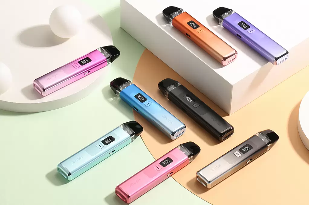 a range Geekvape WENAX Q vape pod system devices on a colourful surface