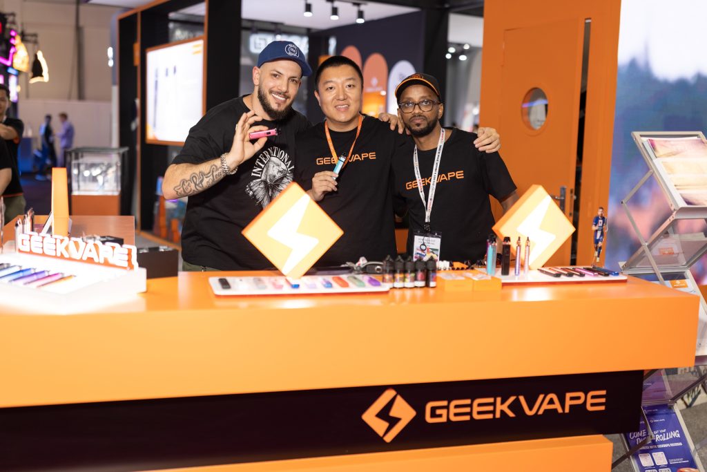 geekvape team posing for a photo in front of their exhibition stand