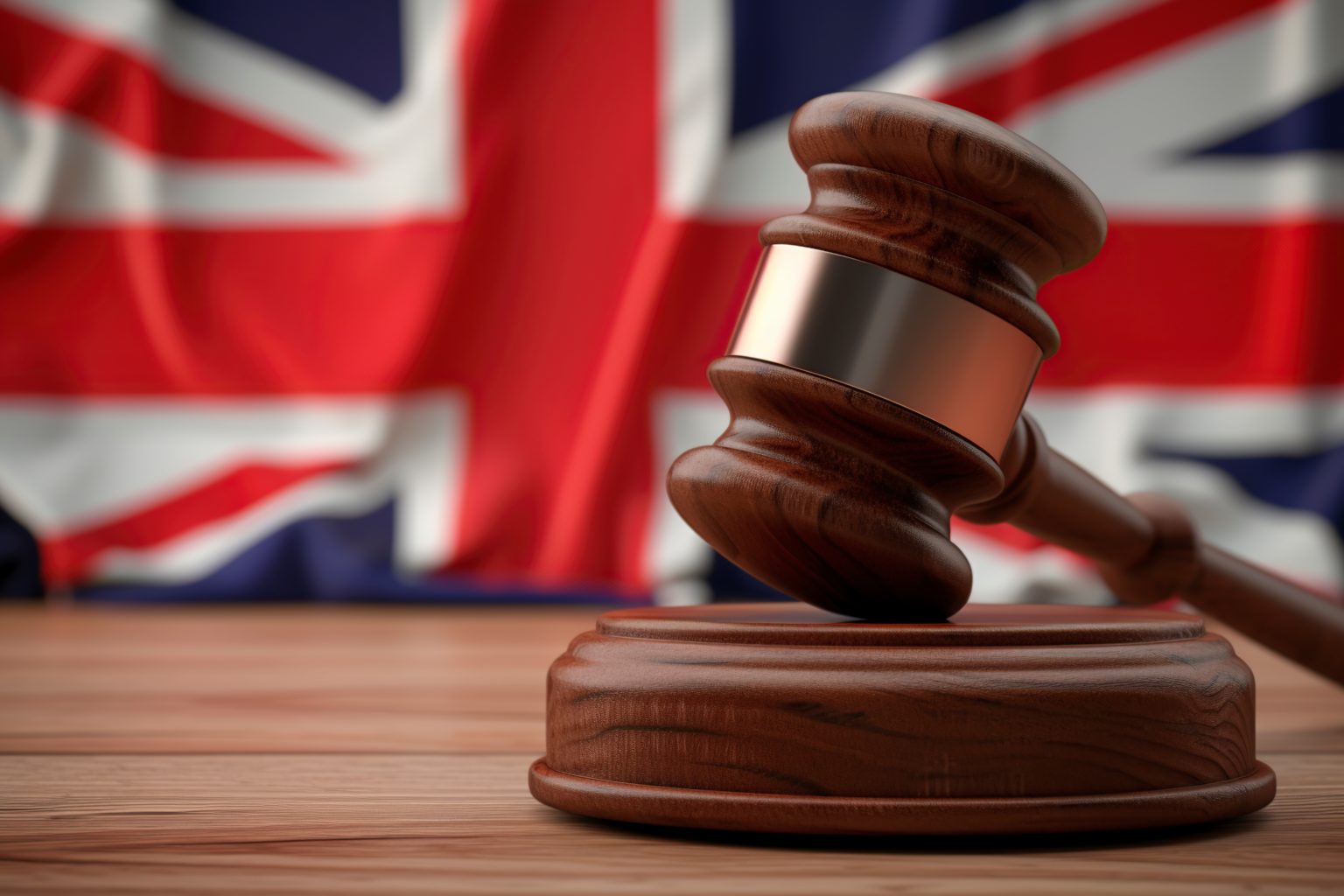 A wooden judge's gavel with the flag of England